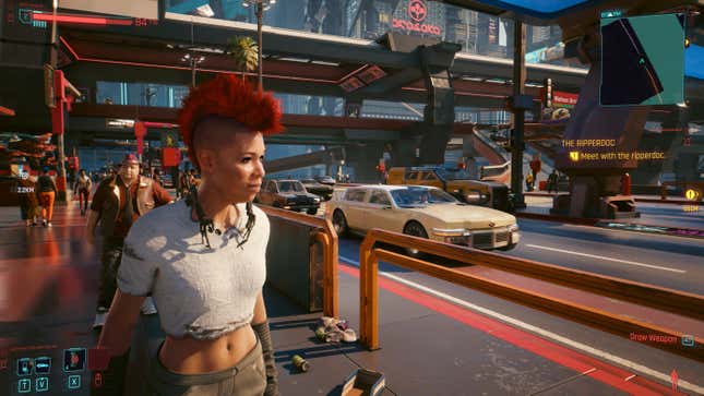 A Black woman with a red mohawk stands in the foreground on the streets of Night City as a luxury car goes past on the street behind her.