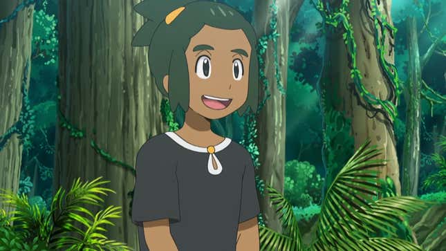 Hau is shown sitting in a jungle area talking to someone off-screen.